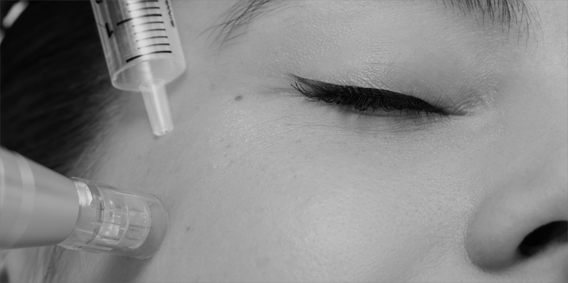 A woman with her eyes closed and a comb in her ear.