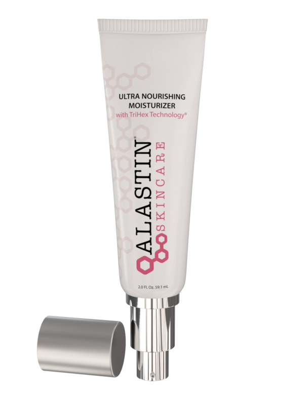 A tube of alastin moisturizer next to a roll of paper.